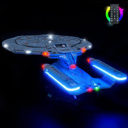 Sci-fi starship brick model with glowing blue and red LED lights on its saucer and engines