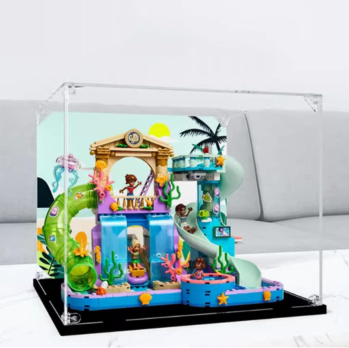 Square clear acrylic case over a colorful waterpark brick model with slides – view 2