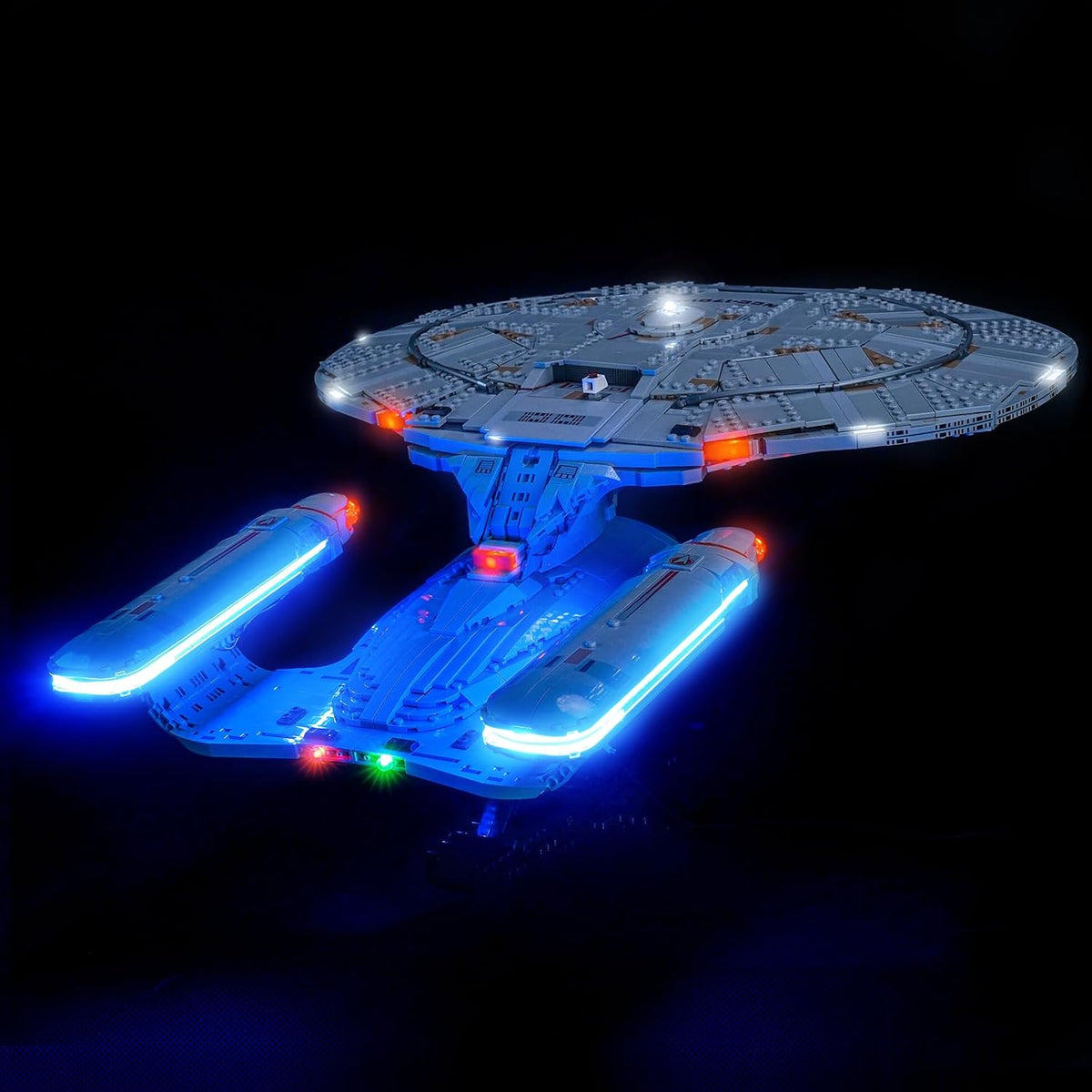 Saucer-section starship brick model glowing with LED lights – view 2