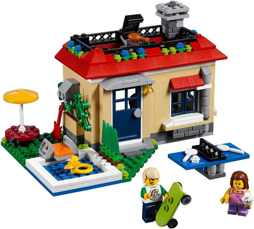 Brick holiday house with rooftop pool and two minifigures