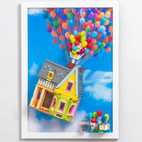 Brick-built house lifted by colorful balloons mounted on a wall display board