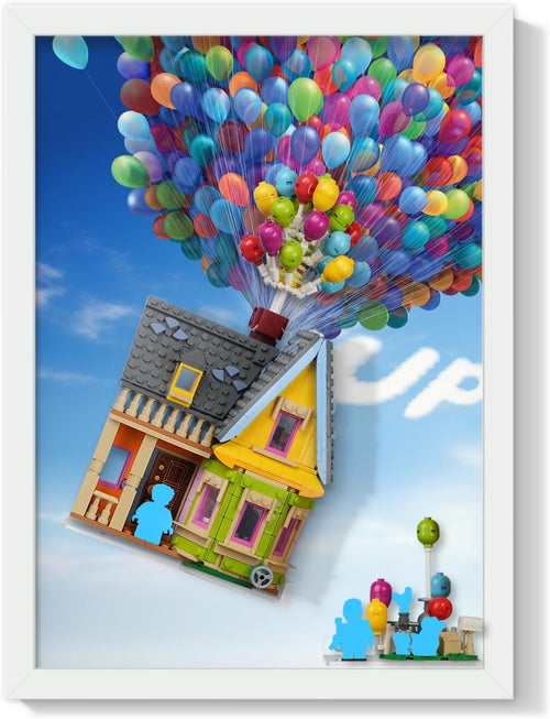 Wall-mounted display board with sky and balloon backdrop holding a small brick-built house