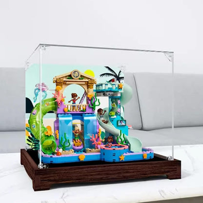 Square clear acrylic case over a colorful waterpark brick model with slides