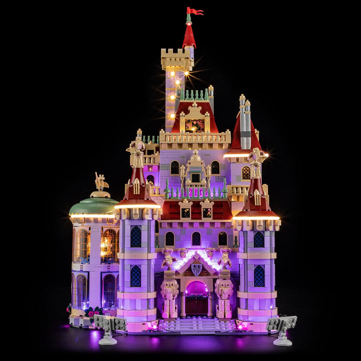 Fairytale castle brick model with towers lit by warm LED lights