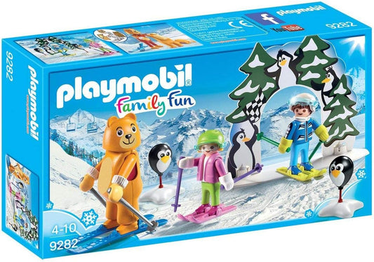 Ski lesson play scene with skier figures on a snowy slope