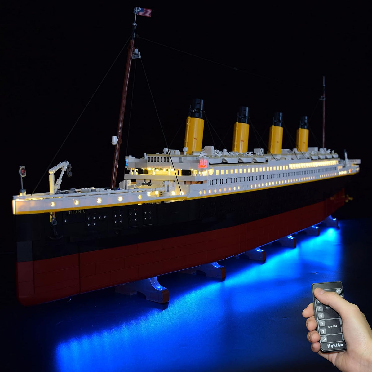 Long ocean liner brick model glowing with LED lights along its decks