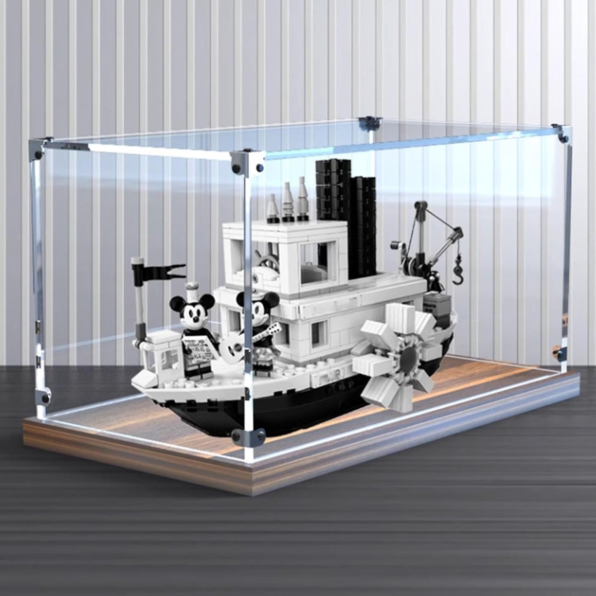 Clear acrylic case on a gold oak base displaying a steamboat brick model – view 2