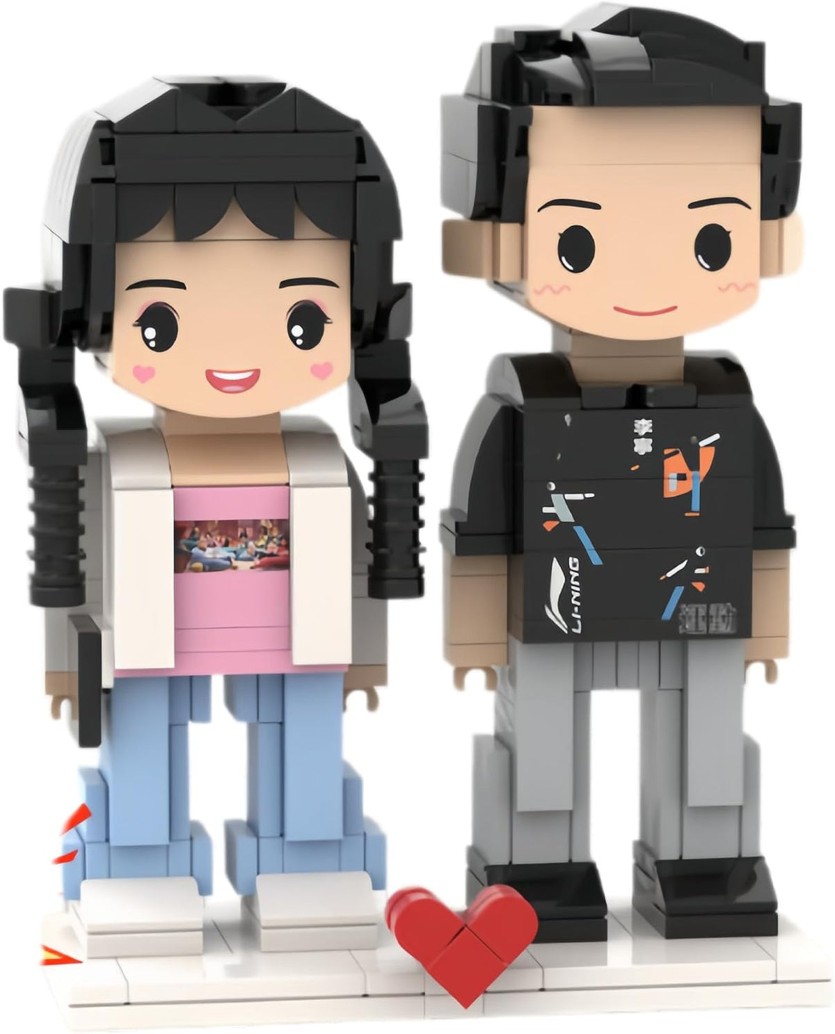 Two custom brick couple figures on a display easel next to a small photo frame