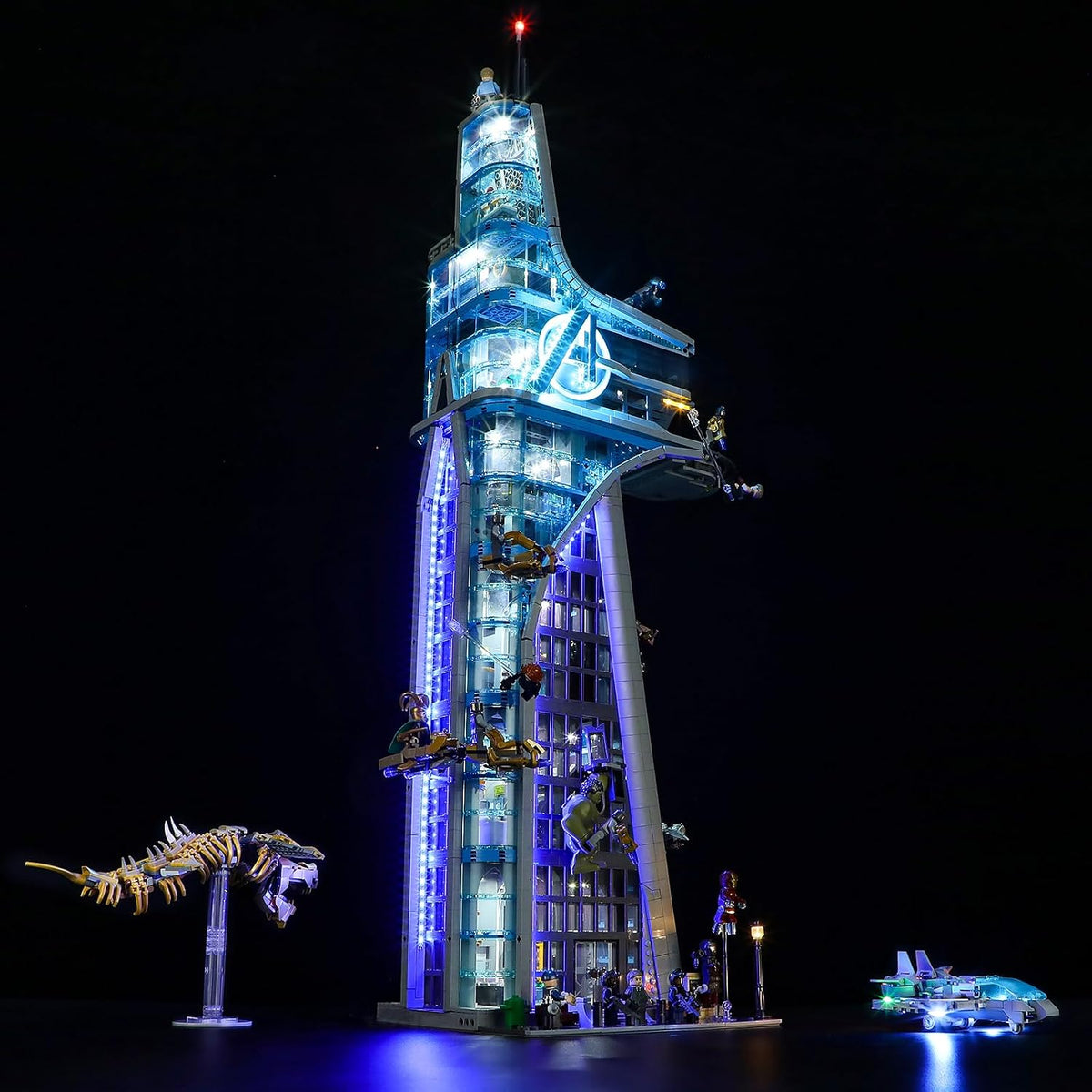 Tall superhero skyscraper brick model glowing with installed LED lights at night