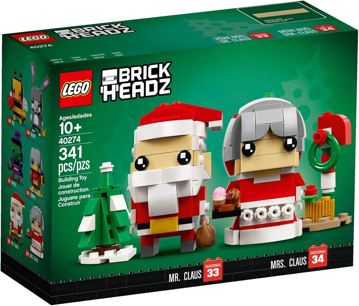 Square-head brick figures of Santa Claus and Mrs. Claus in red outfits