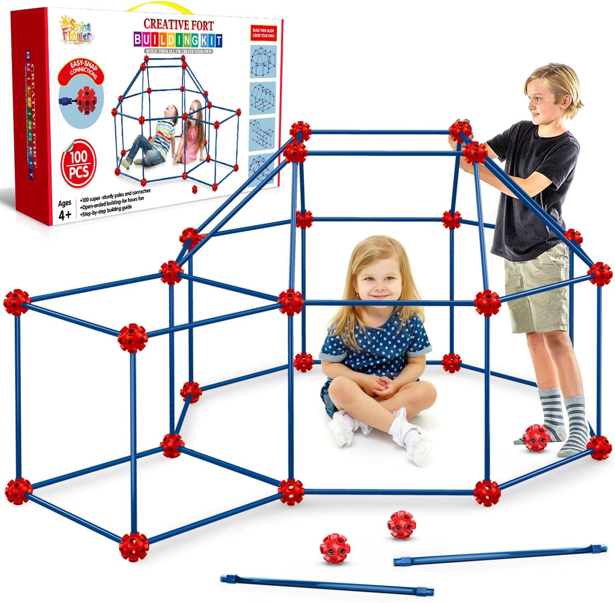 Child-sized fort made of rods and connector balls glowing green in a dark room – view 10