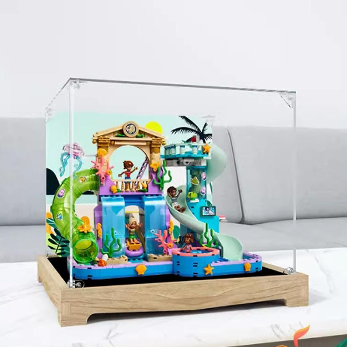 Square clear acrylic case over a colorful waterpark brick model with slides – view 3