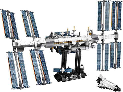 Brick-built International Space Station on a display stand with mini shuttle