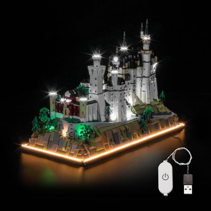 Brick-built Neuschwanstein Castle with towers lit by LED lights – view 2