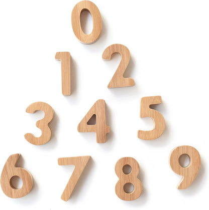 Bamboo alphabet blocks with printed letters stacked in a row – view 2