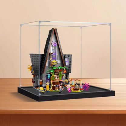 Cube acrylic display case around a luxury home brick model