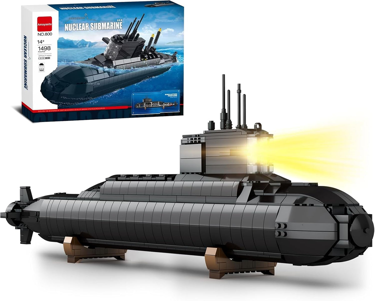 Gray brick-built military submarine model on a display stand with LED lights