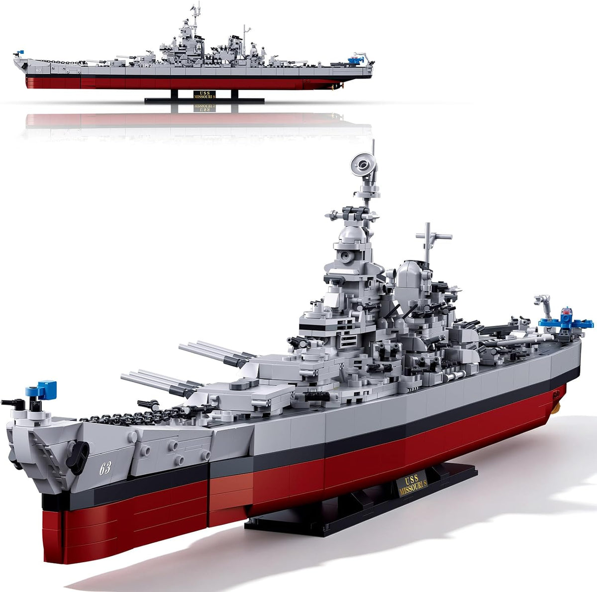 Brick-built WWII battleship model with rotating turrets on a display stand – view 2