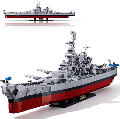 Brick-built WWII battleship model with rotating turrets on a display stand – view 2