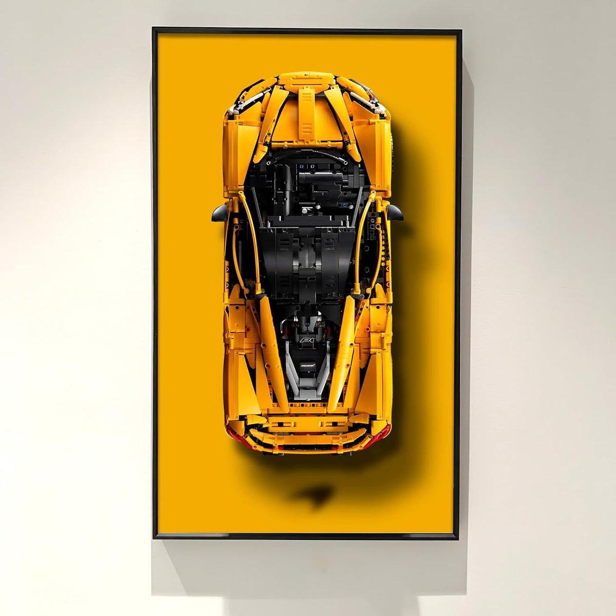 Wall-mounted display frame holding a large technical supercar brick model – view 3