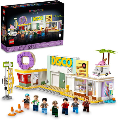 Brick-built disco stage with seven band figures holding microphones and a small donut shop