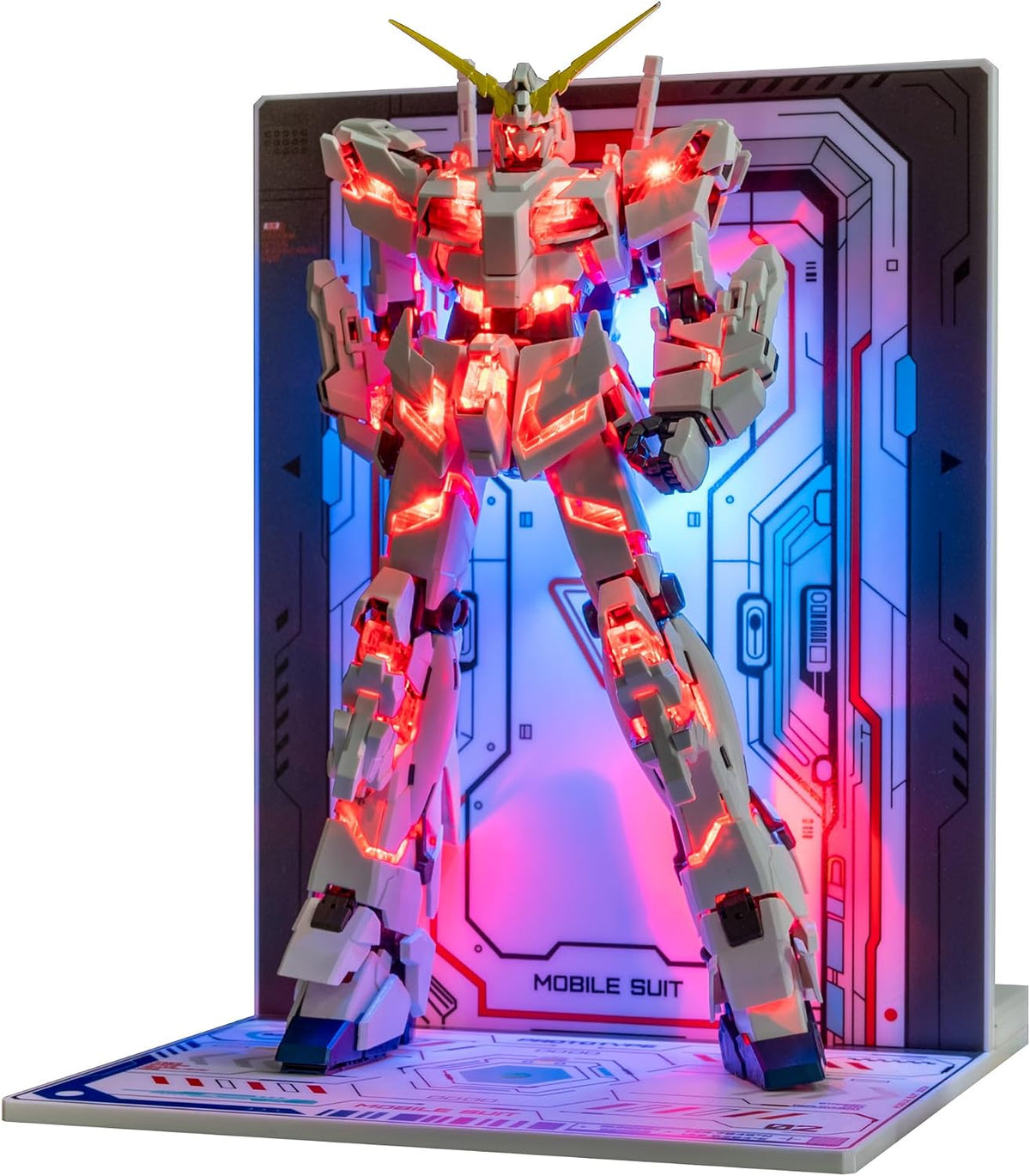Wireless LED bead glowing inside a model figure above an induction transmitter – view 6