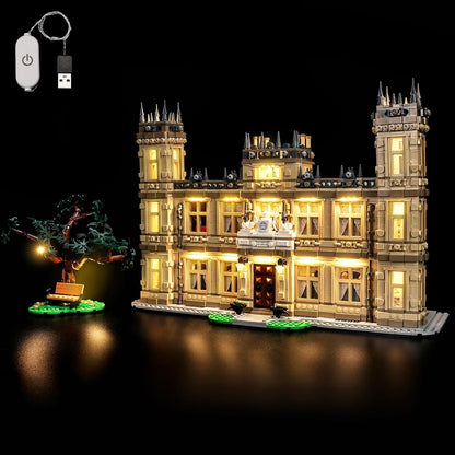 Brick-built English country manor house glowing with warm LED lights – view 2