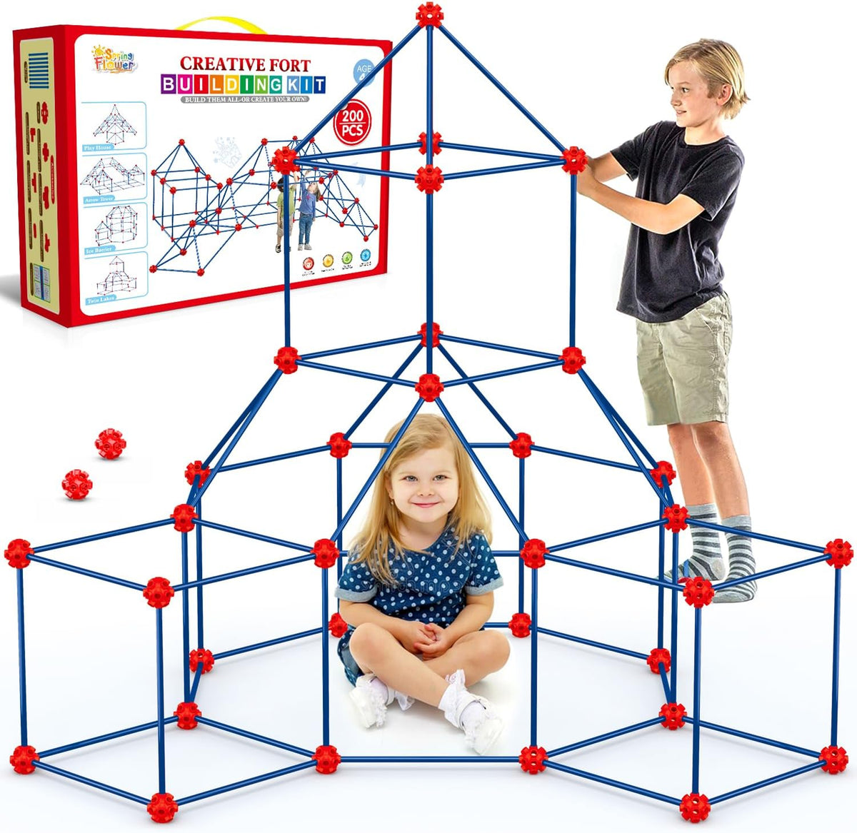 Child-sized fort made of rods and connector balls glowing green in a dark room – view 3