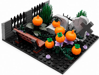 Brick-built Halloween graveyard with gates, tombstones, ghosts and pumpkins – view 3