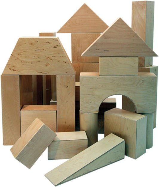 Stack of large natural birch plywood hollow blocks forming a small wall