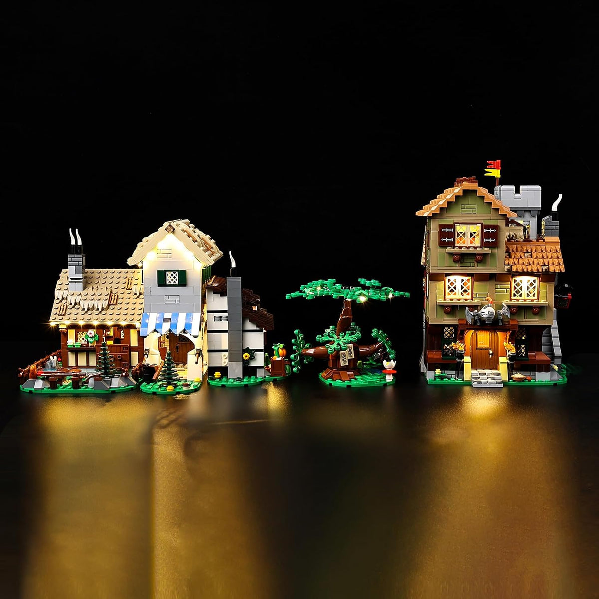 Medieval town square brick model glowing with warm LED lights at night