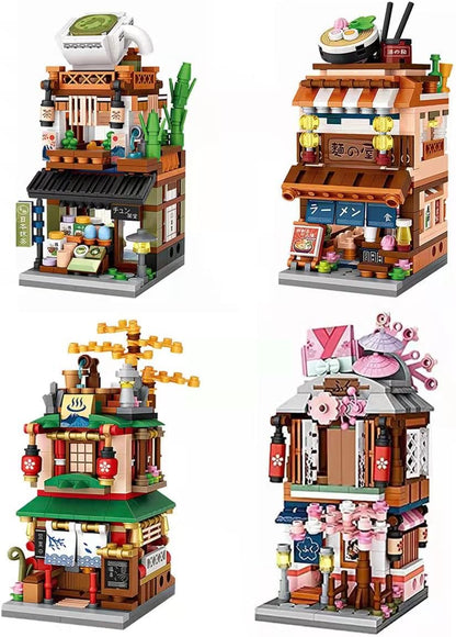 Four miniature brick-built Japanese street shops lined up with lanterns and signs – view 4