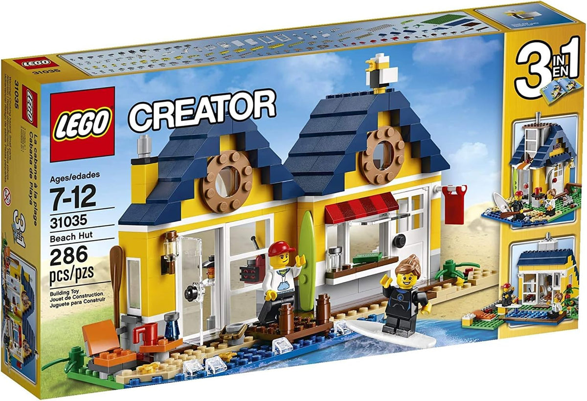 Brick-built beach hut with pier, surfboards and seagull on tan sand