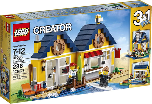 Brick-built beach hut with pier, surfboards and seagull on tan sand