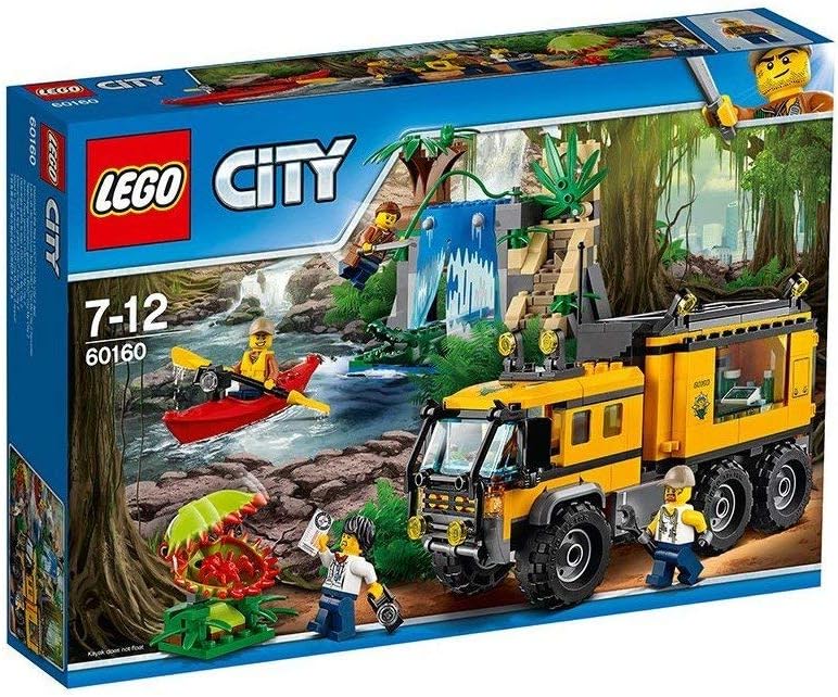 Jungle mobile lab truck with kayak beside a hidden waterfall