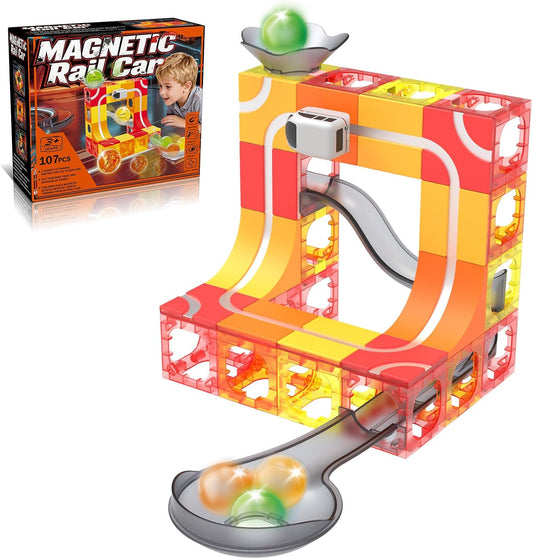 Magnetic tile tower with marble run track and a small electric train circling it