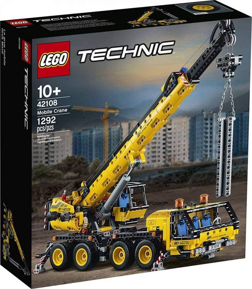 Large brick mobile crane with extended boom and eight wheels