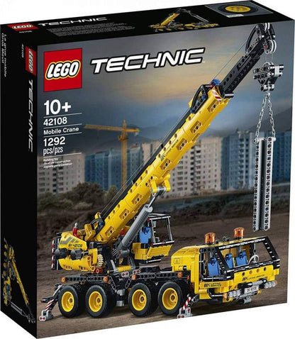 Large brick mobile crane with extended boom and eight wheels