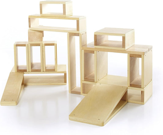 Sixteen hollow wooden building blocks stacked into a small wall