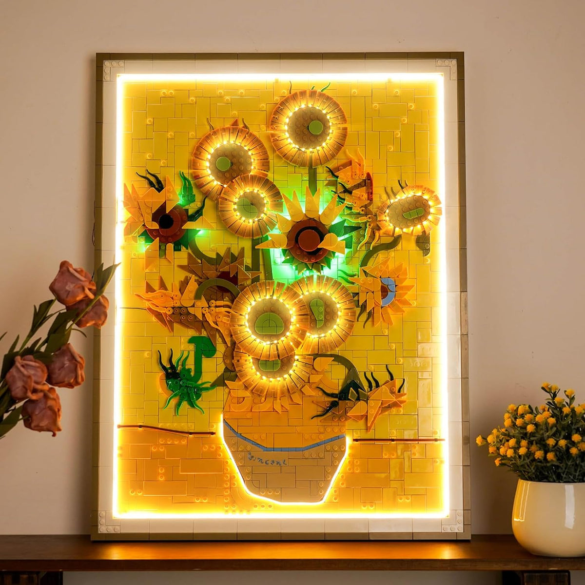 Brick-built sunflowers in a vase painting lit by small LED lights – view 2