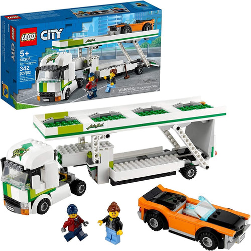 Car transporter truck with raised deck and muscle car on the ramp
