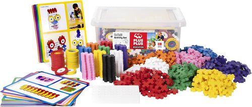 Tub of colorful interlocking puzzle-shaped pieces with flash cards