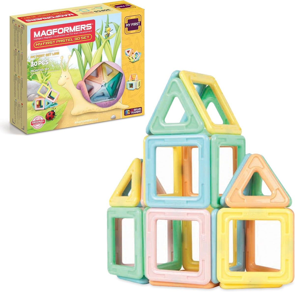 Pastel magnetic squares and triangles snapped into a simple 3D shape