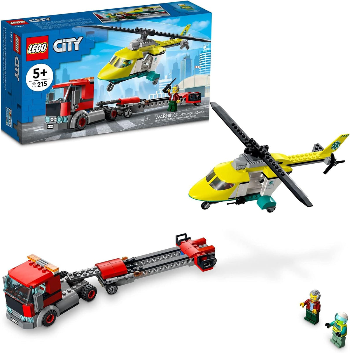 Red transporter truck carrying a rescue helicopter on an articulated trailer