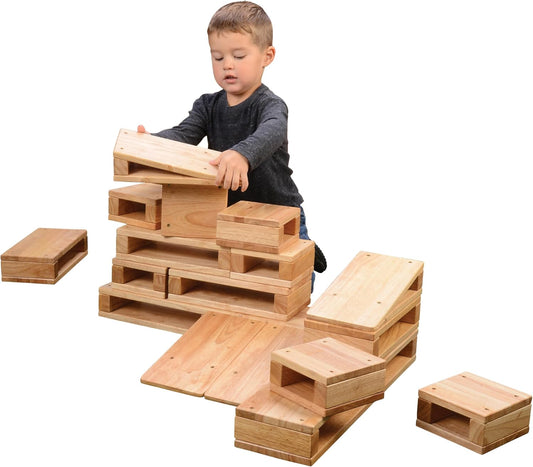 Eighteen large hollow hardwood blocks in assorted shapes stacked into a structure
