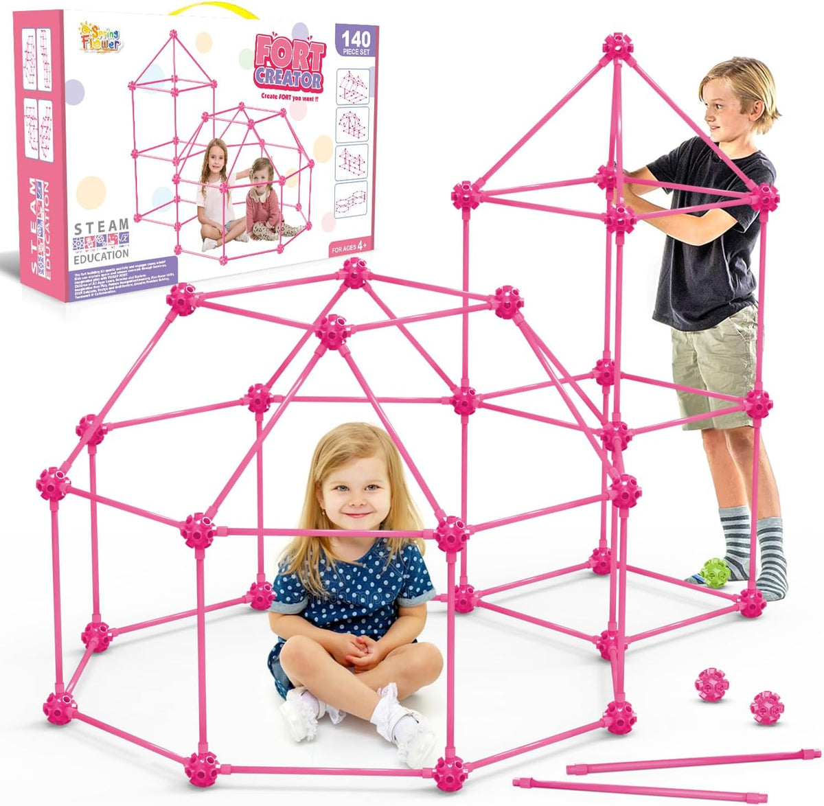 Child-sized fort made of rods and connector balls glowing green in a dark room – view 12