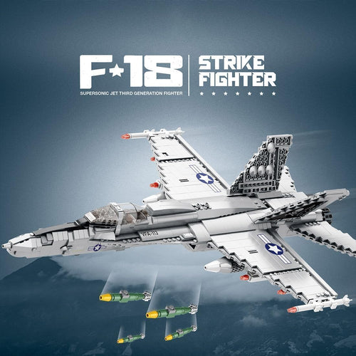 Gray brick-built naval strike fighter jet with folding wings and missiles