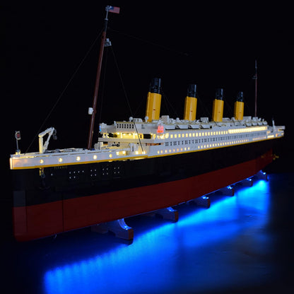 Long ocean liner brick model glowing with LED lights along its decks – view 2