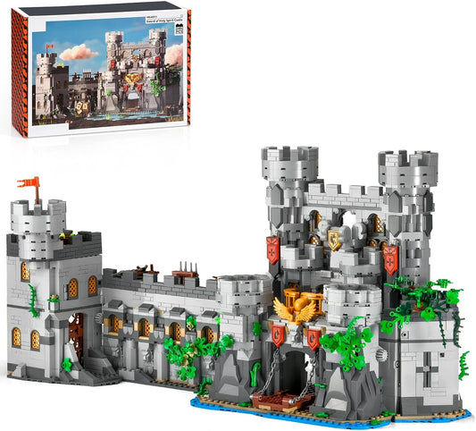 Brick-built medieval stone castle with towers, walls and banners