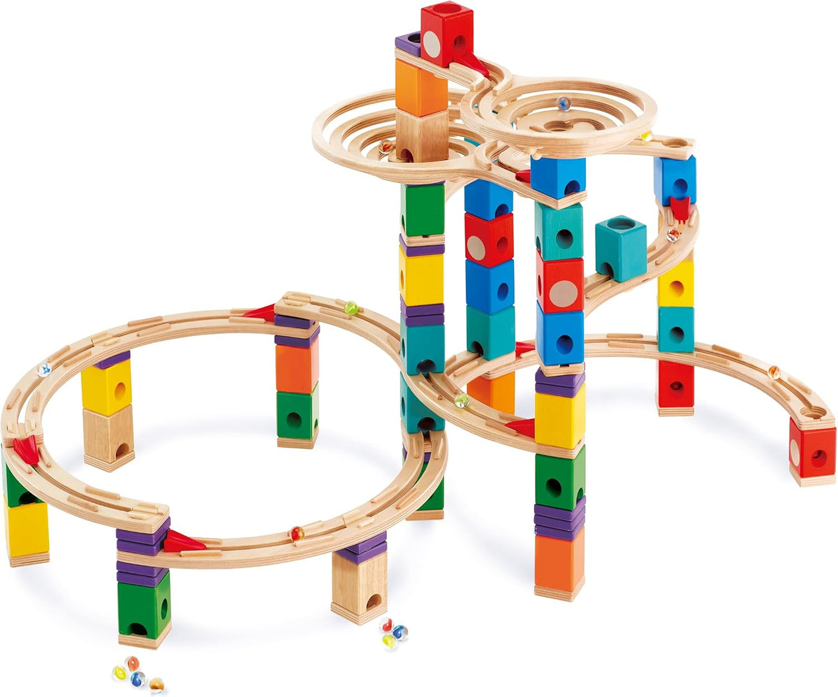 Wooden marble run tower with a spiral cyclone funnel and marbles racing down